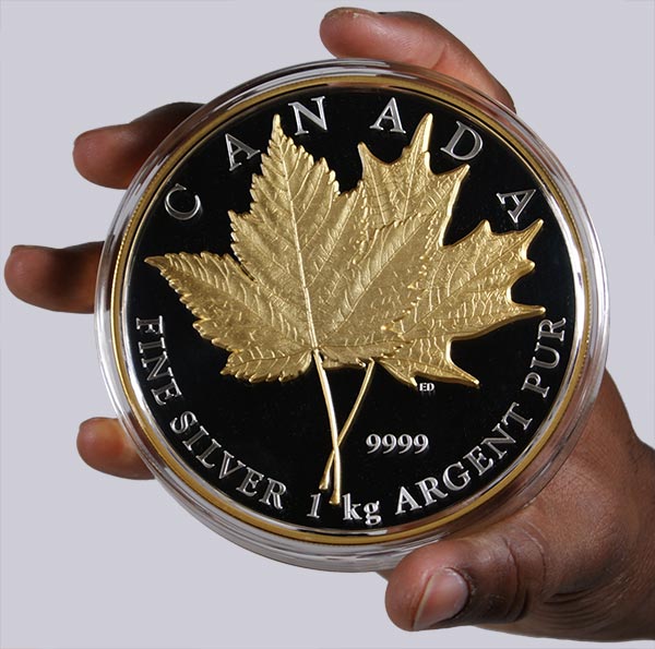 2013 Maple Leaf Forever 1 kilogram coin in hand